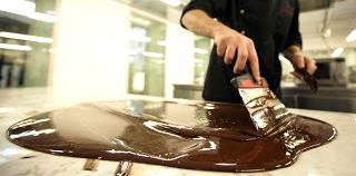 Tempering the chocolate is important to achieve the following criteria in the end product: Snap when broken Hard bite of the coat Shiny gloss Soft melting in the mouth Shelf life Reduce fat bloom.