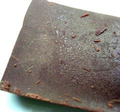Sugar bloom is a grey bloom, which is generally caused by dampness or condensation dissolving the surface of chocolate, which recrystallises on drying.