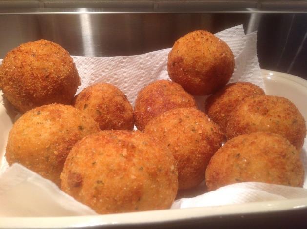 Arancini (continued) Forming the Arancini vegetable oil for frying 4 cups risotto rice fresh mozzarella, ciliegine size works well marinara sauce 2 cups seasoned bread crumbs ¼ cup shredded Parmesan