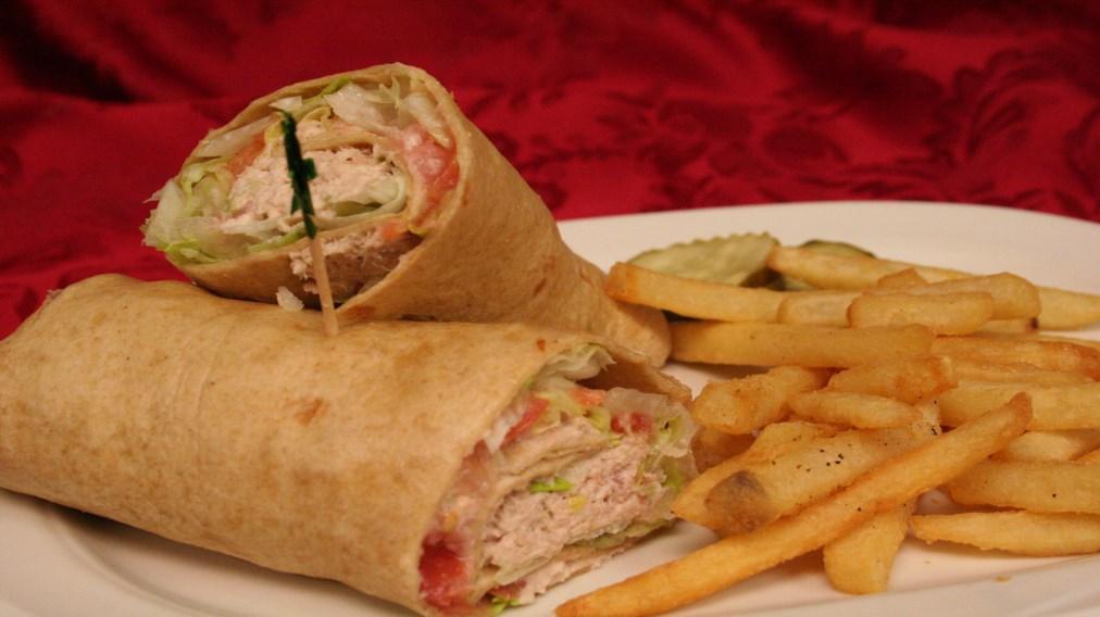 69 topped onion rings, cheddar cheese and bbq sauce, served with french fries, chips or cup of soup Tuna, Chicken or Egg Salad Wrap 7.99 Chicken Caesar Wrap 8.29 Greek Wrap 8.