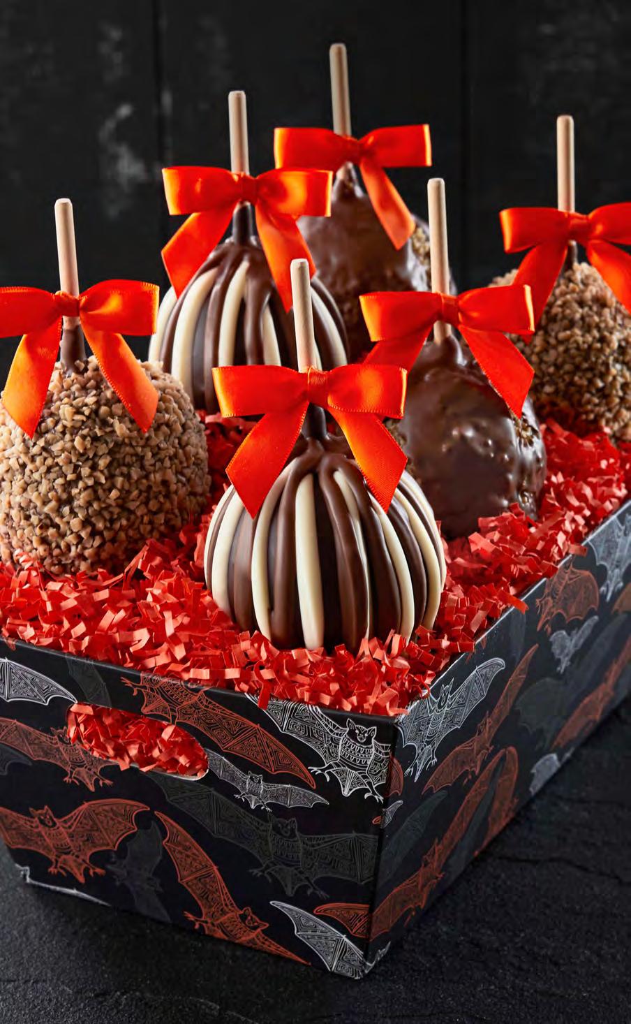 99 Spooky Six Petite Caramel Apple Tray Six spooky chocolate-dipped Petite Caramel Apples are dressed up for Halloween with costumes that include fun candies and contrasting chocolate details.