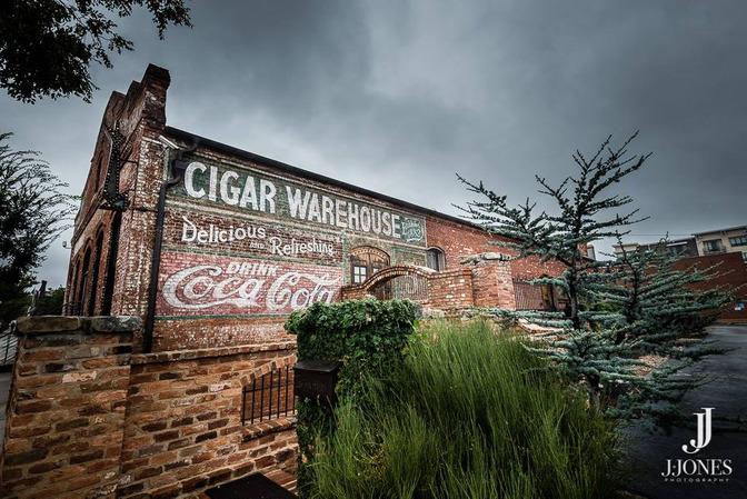 CORPORATE EVENTS The Venue Built in 1882 and originally used as a warehouse to store cotton and cigars, the Old Cigar Warehouse was renovated in 2013 as an event venue.