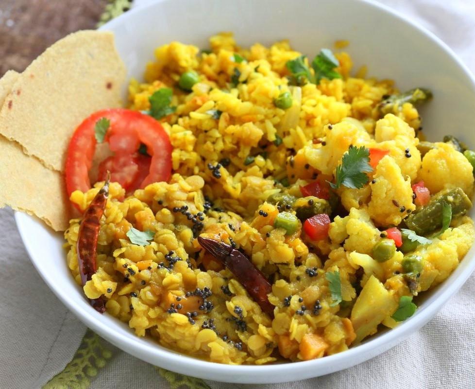 Turmeric Rice Ingredients 1 cup Basmati rice 1 tsp Turmeric 1/2 cup fresh or frozen peas 1/2 cup cubed carrots 2 cups vegetable broth Salt and Pepper In a Dutch pan heat oil and sauté onion until