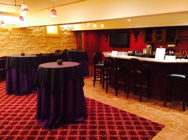 Amenities: 10 square tables & 40 padded chairs Custom bar with 8 barstools Technology includes 50 projection screen (attached to a laptop or for Cable TV) Seating capacity up to 40 for sit down, 50