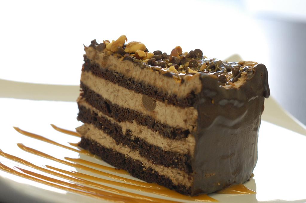DESSERTS PARADISO Four moist chocolate cake layers, filled with chocolate mousse,