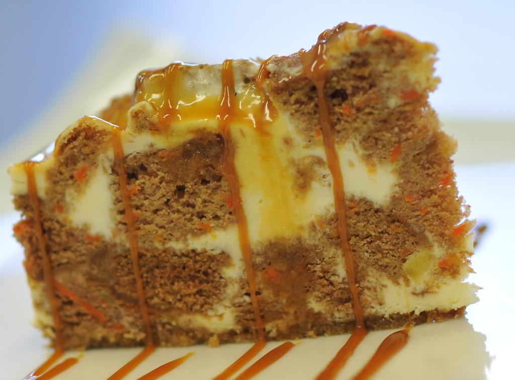50 CARROT CARAMEL CHEESECAKE A luscious cheesecake filled with chunks of moist