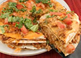 Baked Quesadilla Stack 1 c. vegetarian refried beans ½ c. cashew cheese or Velveeta (melted) ¼ c. salsa 4 (8 inch) flour tortillas 2/3 c. chopped green peppers 2 Tbls. chopped white onion 1 c.