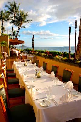 Gaze at lush greenery, swaying palm trees, tiki torches, and the breathtaking view of the sunset over Keawakapu Beach, the lanai can