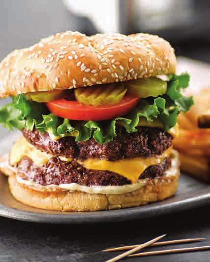 All-American Burger Two fresh grilled beef patties, topped with classic favorites: Cheddar cheese, crisp lettuce, sliced tomato and onion, dill pickles and creamy Hellmann s /Best Foods Mayonnaise on