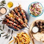 QR 179 Served With 4 Skewers Of Chicken, 4 Skewers Lamb, 4 Meatballs Accompanied With Grk Fries, Aegean Slaw, House-Baked Pitas & Tzatziki.