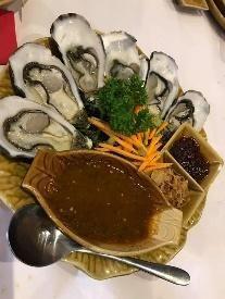 Natural Oysters Entree Natural oysters served with spicy sauce of coriander root,