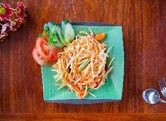 13. Som Tum Thai Papaya Salad Traditional mild salad from Central Thailand with shredded green papaya mixed with fresh chilli, garlic, dried shrimp, green bean, tomato, fish sauce, lemon juice