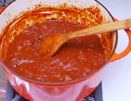 14 Remove the lid, increase the heat, and simmer the liquid, stirring often, until the