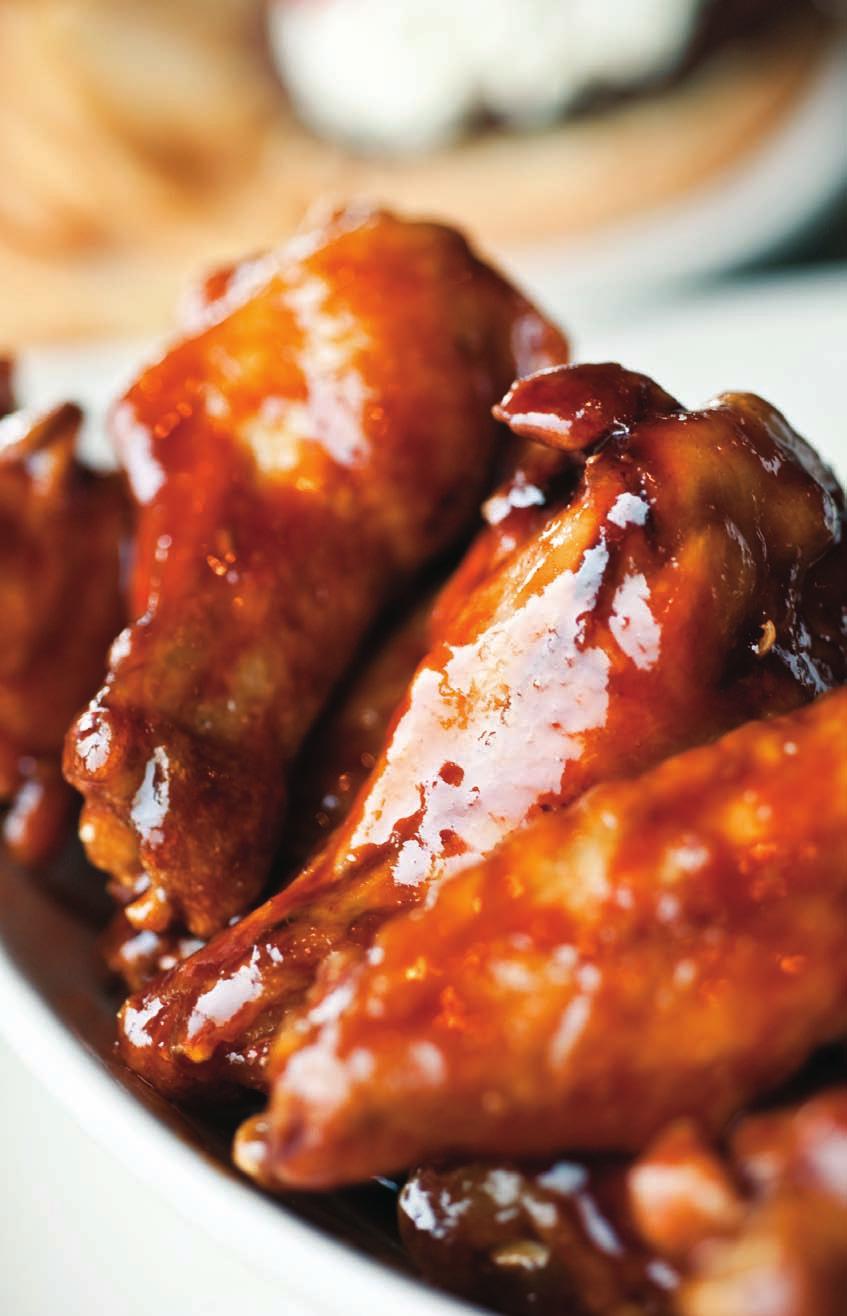Teriyaki Chicken Wings with Hot Mango Dipping Sauce Brushing several times with an all-natural sauce gives these baked wings intense flavor and crunchy skin.