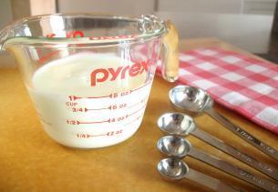 Pack fats into a dry measuring cup, level the top, and remove with a rubber spatula, OR use a