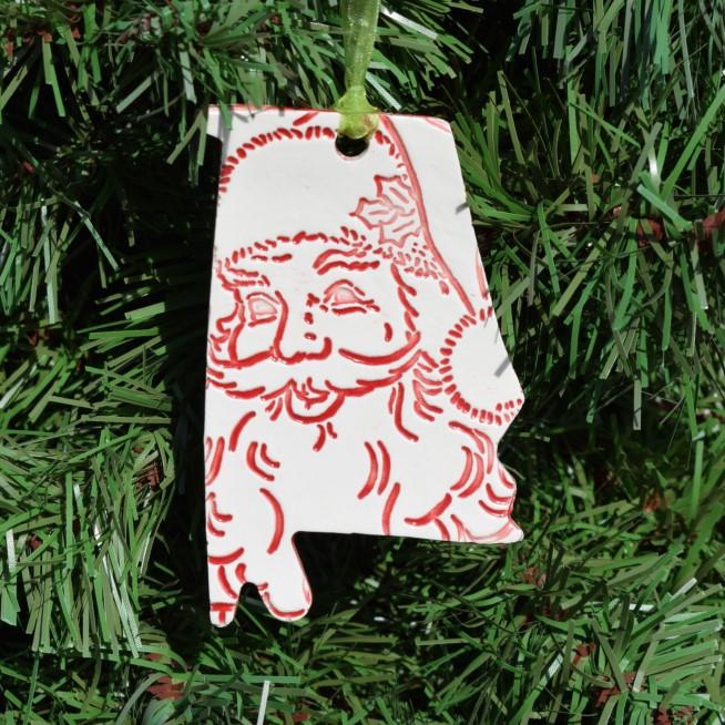 In the shape of Alabama, this ceramic ornament has lots of whimsical detail.