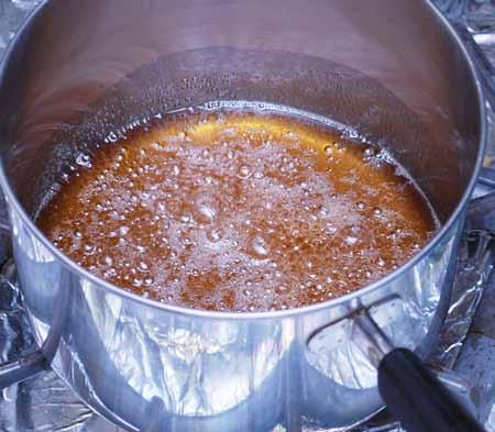 3 3 Heat the 2 cups of sugar with the water in a saucepan over medium heat until the liquid comes to a boil and