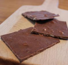 Chocolate & coconut bark 80g organic coconut oil 3 tbsps organic cocoa powder 1 tsp stevia/xylitol 80g chopped nuts 50g chocolate flavoured whey protein (optional) SERVES 6 A low carb treat that