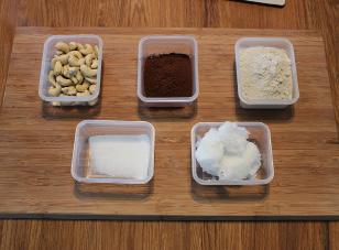 Line a baking tray with greaseproof paper and put in the freezer. Melt the coconut oil gently in a pan over a medium/low heat. Add the cocoa powder and stevia/xylitol. Stir well to combine.