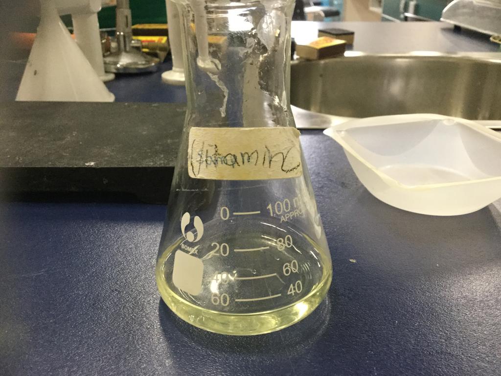 14. Set up the 50mL buret on the ring stand. 15. Measure 20mL of vitamin C standard solution with 50mL cylinder and pour it in the 50mL Erlenmeyer flask. 16.