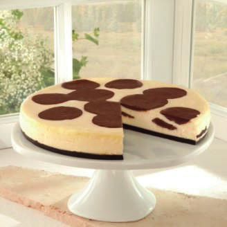 Brown Cow Chocolate Pudding Cheesecake Dollops of rich, fudgy chocolate pudding set in the creamiest of cheesecakes.