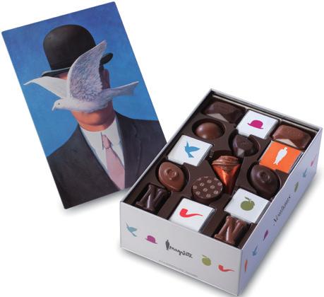 two unique, artistic gift boxes filled with delicious chocolates and crunchy
