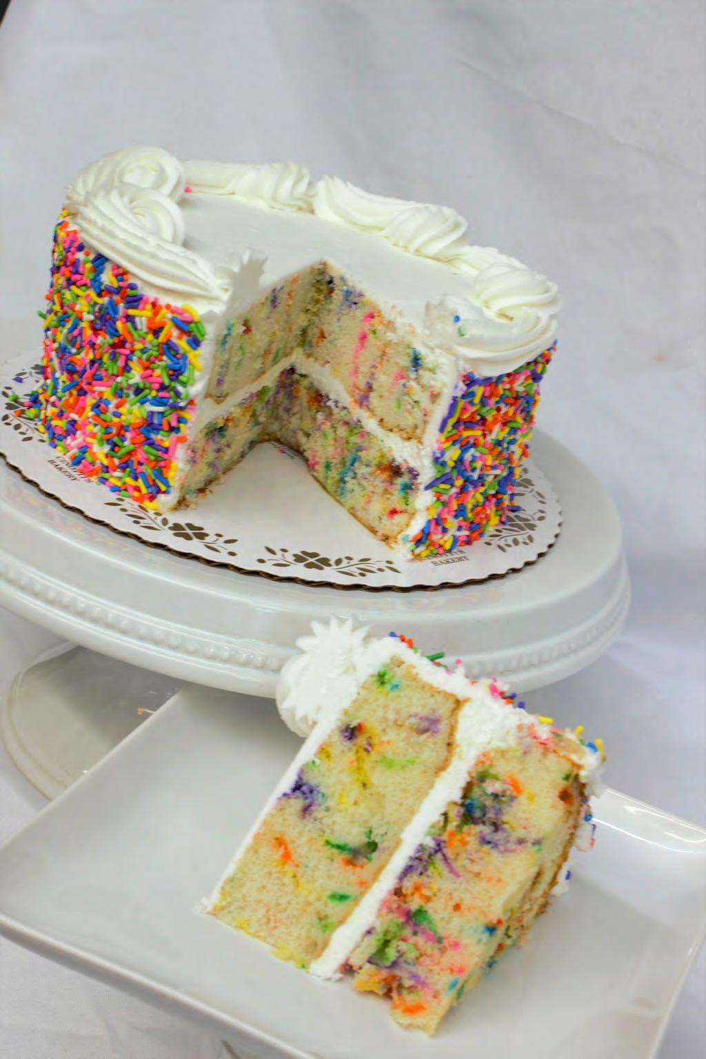 Topped with our homemade Buttercream and rolled in colorful sprinkles.
