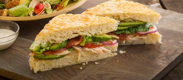 SANDWICHES FAMOUS SANDWICHES TURKEY BACON AVOCADO ON FOCACCIA (845 cal) Slow-roasted, hand-pulled turkey, bacon, Kneaders sauce, provolone cheese, lettuce, tomatoes, red onions, avocado, salt &