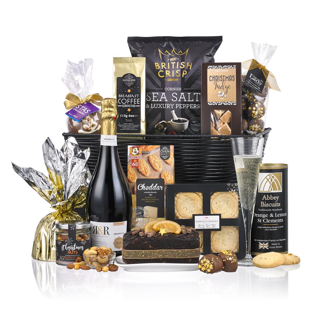 THE MAGIC OF CHRISTMAS Presented in a man-made woven basket containing: R&R Robert & Reeves Prosecco 11% vol Abbey Biscuits Handmade Orange & Lemon St Clements 150g Barfield Bakery Mince Pies x 4