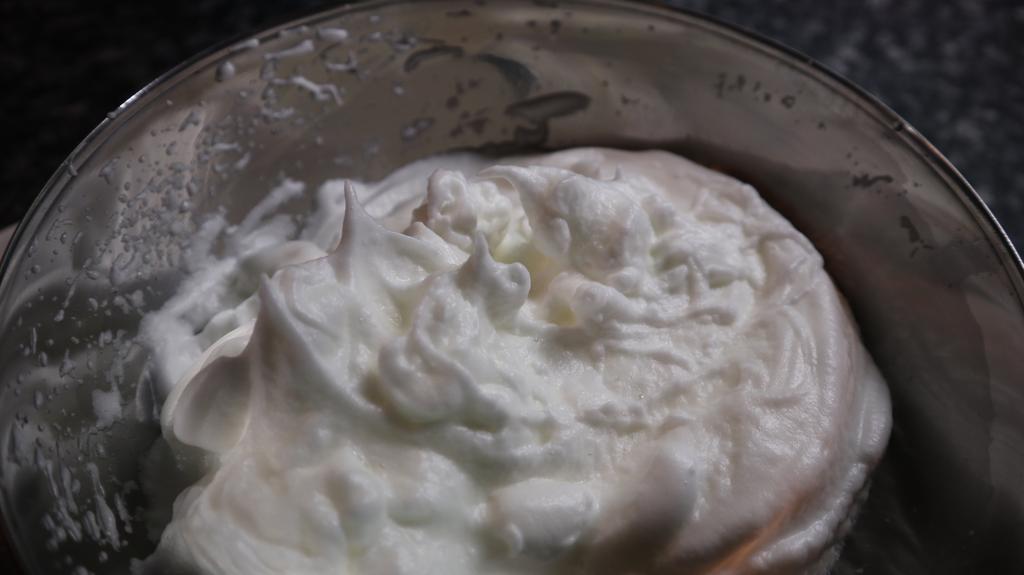 Make sure to add the sugar in slowly while mixing, not all at once. 7. Stop beating once the meringue has formed stiff peaks.