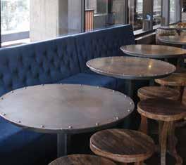 couches. It features cinema chairs and tables lining the Swanston Street side of the bar.
