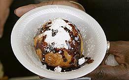 Fried Mexican Ice Cream 1 pt. vanilla or other flavor ice cream 1/2 c. crushed corn flake or cookie crumbs 1 tsp. cinnamon 2 tsp. sugar 1 egg Oil for deep frying Honey Whipped cream 1.