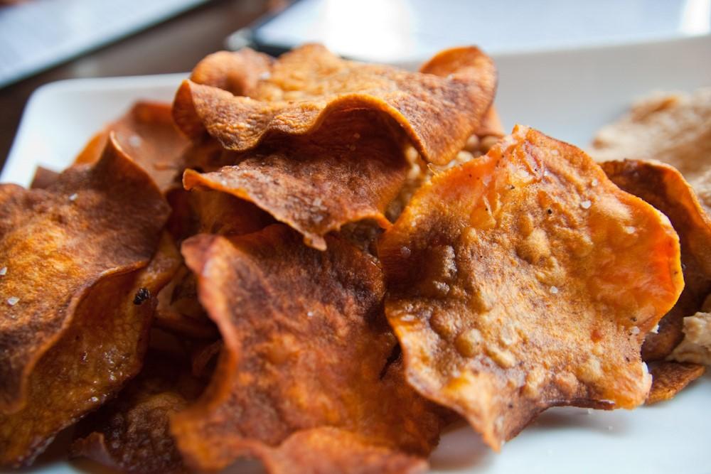 Sweet Potato Chips 1 lb. Sweet potatoes, thinly sliced 2 Tbsp Canola oil 1 tsp Cumin 1 tsp Citric acid salt Preheat oven to 400 F on convection.