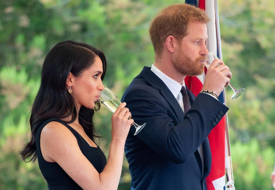 DUBLIN, IRELAND - JULY 10: Prince Harry, Duke of Sussex and Meghan, Duchess of Sussex raise a toast as they attend a Summer Party at the British Ambassador's residence at Glencairn House during their