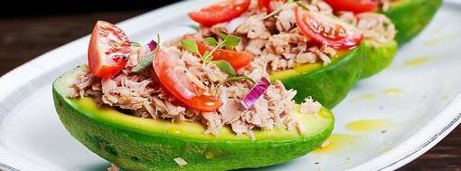 Tuna Boats 9 ingredients 5 minutes 1 serving 1. Cut avocados in half lengthwise and remove the stone leave the peel on. In a large mixing bowl mix together the tuna, celery, onions, mayo and spices.