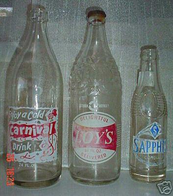 Enjoy A Carnival Cold Drink 24 fl oz. On the back This bottle remains the property of Brough Bros Pty Ltd Unanderra Please return empty bottles promptly. Crown seal AGM (skirt) on base; 26cm height.