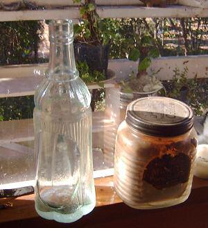 Above left is a full photograph of the bottle with 1941