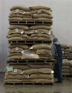 In this photo taken Wednesday, March 4, 2015, packaged coffee pods highlighting the biodegradability of it's product, are stacked for shipment from the Rogers Family Company in Lincoln, Calif.