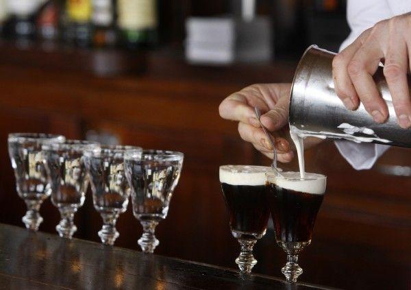 IRISH COFFEE Using a stemmed glass or cup rimmed with sugar, pour 1 ½ OZ.