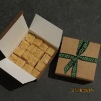Fudge in a box 3.20 Dec Contains; Evaporated MILK, BUTTER, sugar, vanilla essence. Chocolate also includes; cocoa powder.