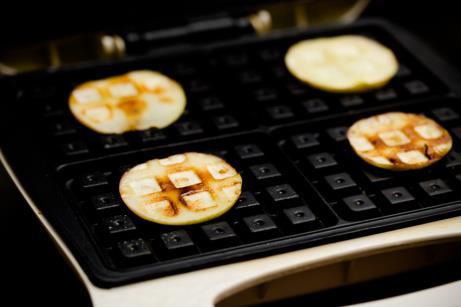 One Minute Waffle Iron Baked Apples Ingredients Non-stick cooking spray As many apples as you want, sliced to just over 1/4" thick Small sprinkle