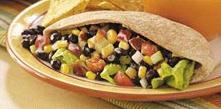 Black Bean & Brown Rice Pitas 2 cups water 1 cup uncooked brown rice 1 (15-ounce) can black beans, rinsed and drained 1 (4-ounce) can diced green chiles 3/4 cup frozen corn kernels, thawed 3 green