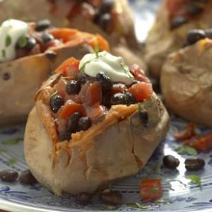 Black Bean-Smothered Sweet Potatoes 1 pound (about 2 medium) sweet potatoes 1 15-ounce can black beans, rinsed 1 cup diced tomato 2 teaspoons extra-virgin olive oil 1/2 teaspoon ground cumin 1/2