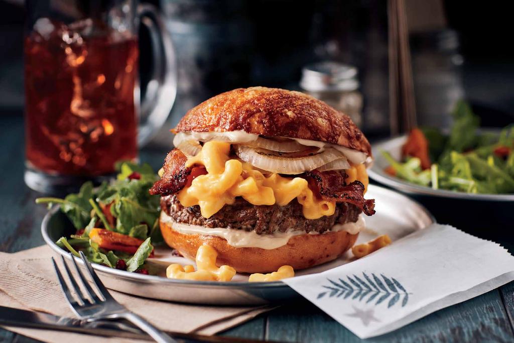 Big Mac N Cheese This recipe has two popular dishes combined into one. Creamy macaroni and cheese on top of a beef burger. Grilled onions and a crazy good tangy mayo sauce rounds it off nicely.