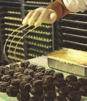 Each decadent Grand Truffle center is hand-rolled and