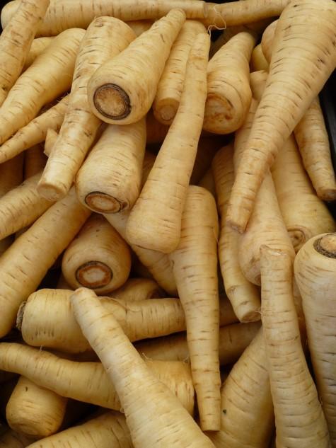 Background: Parsnips A root vegetable with long taproots, similar to a carrot but with a cream-colored flesh Function similarly to potatoes in recipes due to their starch content Have a unique nutty