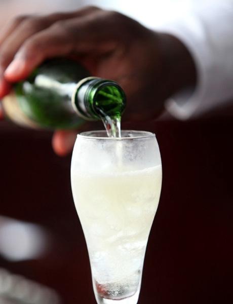 Shake well and strain into a Champagne flute. Top with the Champagne and garnish with a lemon twist.