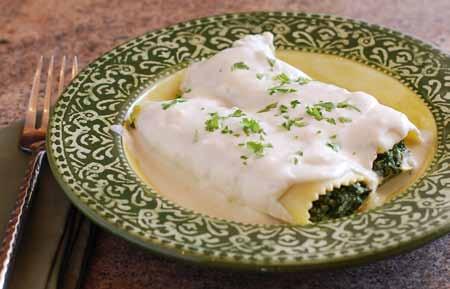 16 To serve, plate one or two cannelloni and drape with more balsamella sauce (heated if necessary).