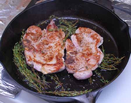 13 8 Wipe the skillet, add more oil, and heat until hot. Add the chops, garlic, and thyme.