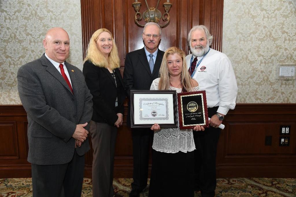 Top shelf Heidi Guyette, manager of the West Lebanon NH Liquor & Wine Outlet (#60) received the Top Shelf Merchandising Award at the New Hampshire Liquor Commission s